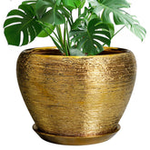 Ceramicfor maceta dorada frontal mostrando diseño elegante y acabado decorativo