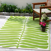 Fab Habitat alfombra frontal verde mostrando diseño tropical y beneficio estético