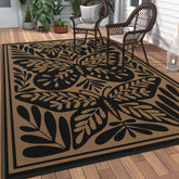 GENIMO alfombra exterior frontal mostrando diseño negro palm leaf y beneficio estética