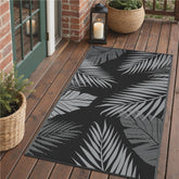 GENIMO alfombra exterior frontal mostrando diseño hoja de palma y apariencia atractiva
