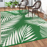 GENIMO alfombra exterior frontal mostrando el patrón de hoja y estilo tropical