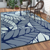 GENIMO alfombra frontal mostrando patrón hojas y beneficio decorativo