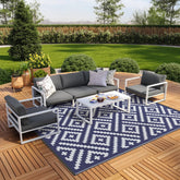GENIMO alfombra exterior frontal mostrando patrón azul blanco y estilo