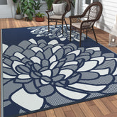 GENIMO alfombra frontal 6'x9' índigo blanco mostrando patrón palm leaf y beneficio estético