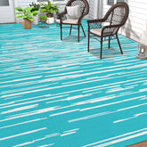 HEBE alfombra exterior frontal mostrando rayas y tamaño, aporta estilo al patio