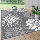 HEBE alfombra exterior frontal mostrando diseño floral y beneficio estético