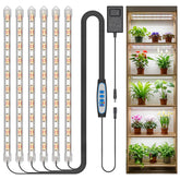 Kullsinss vista frontal de la tira LED beneficiando plantas en maceta