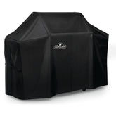 Funda Napoleon frontal ajustada sobre parrilla Prestige 500 protegiendo de lluvia y sol