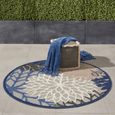 Nourison alfombra Aloha frente del paquete, ideal para decorar exteriores