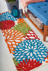 Nourison alfombra Aloha frontal mostrando patrón floral y colores vibrantes