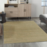 Nourison alfombra frontal mostrando diseño verde dorado y perfil bajo