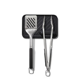 OXO set frontal mostrando pinzas espátula y reposaherramientas, organización eficiente
