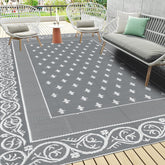 Pauwer alfombra exterior frontal mostrando diseño gris y borde, aporta estilo duradero