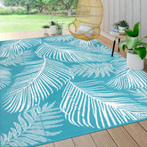 Pauwer alfombra exterior frontal muestra patrón hoja teal y decoración