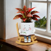 Toparad maceta frontal mostrando diseño silla balancín y sonrisa, aporta encanto