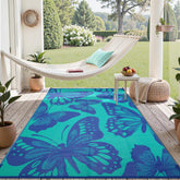 Uphome alfombra exterior frontal mostrando diseño colorido y beneficio decorativo