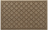 WaterHog felpudo vista frontal mostrando diseño floral y borde de goma para protección
