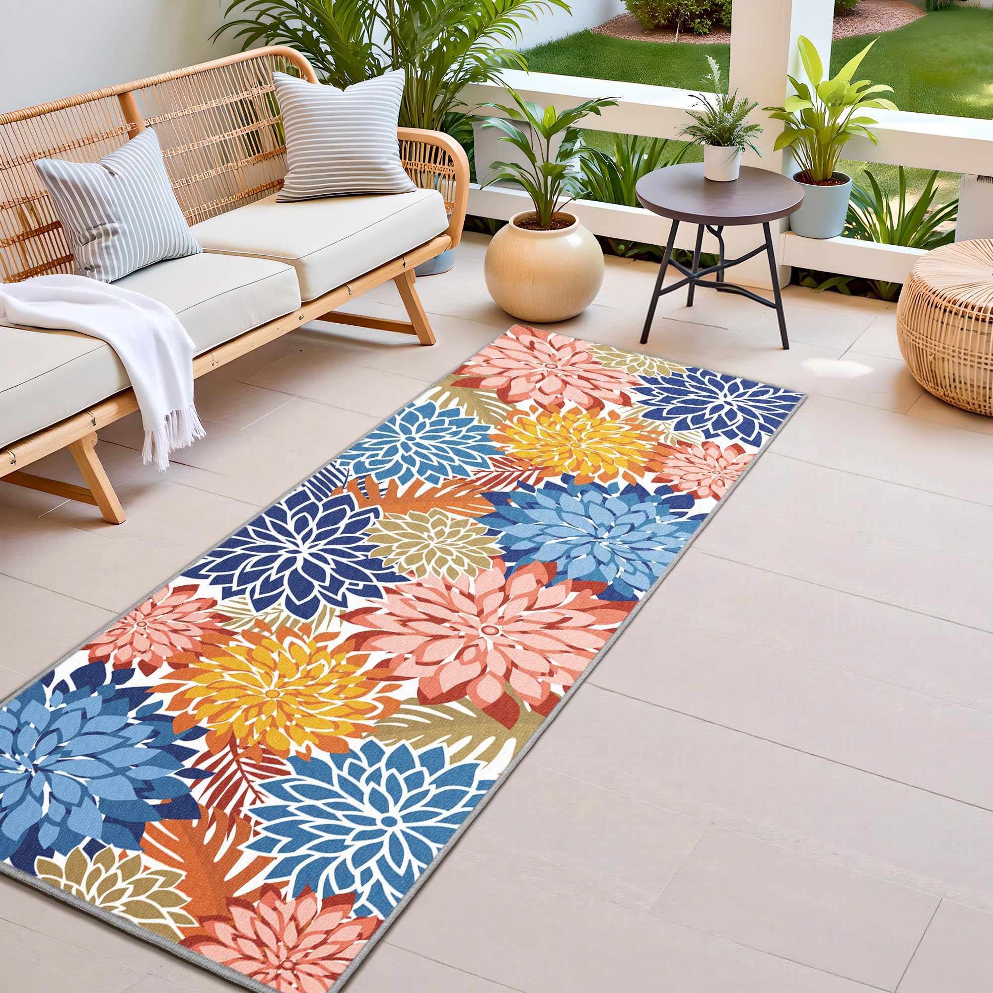 Arenarug alfombra exterior frontal mostrando patrón floral y colores vibrantes