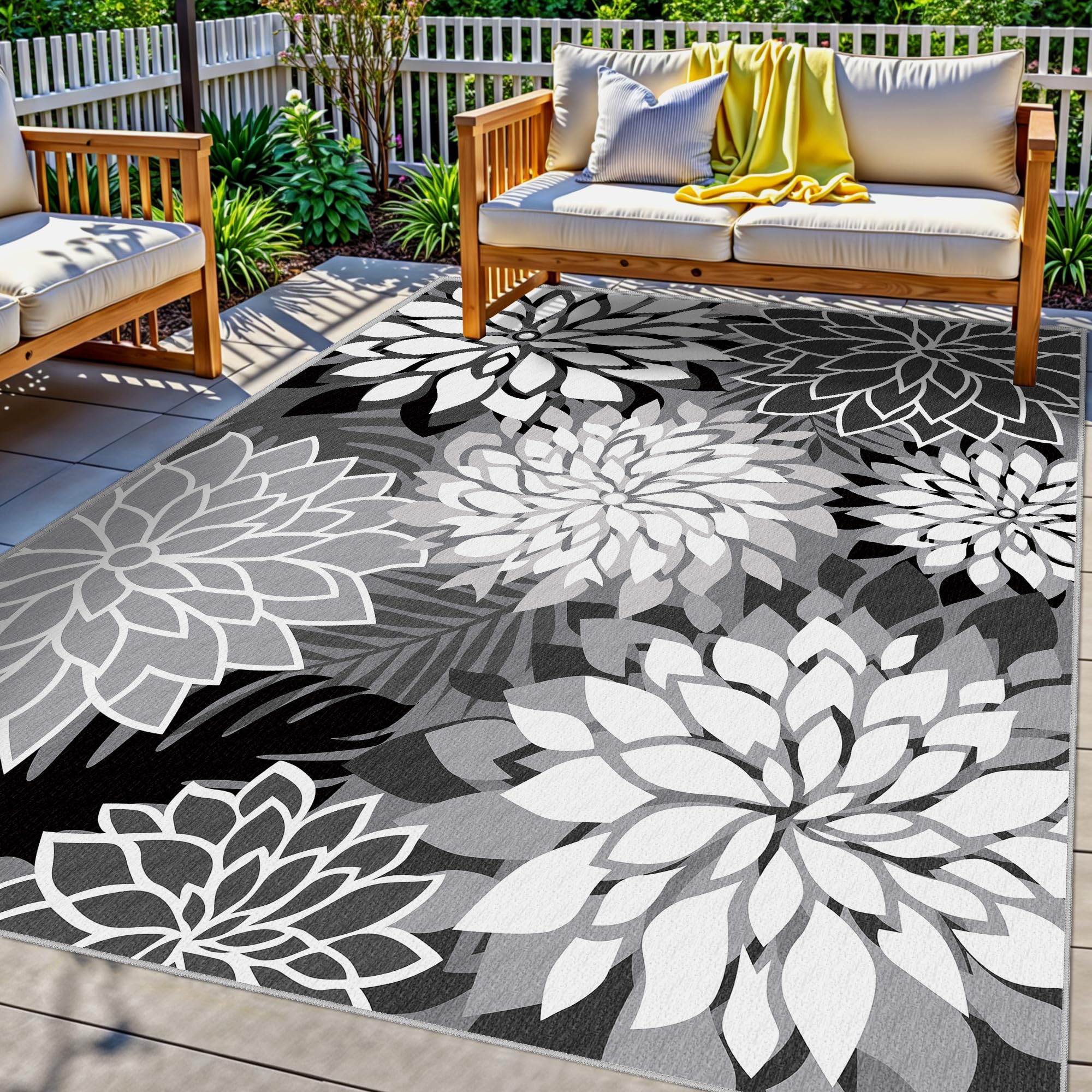Arenarug vista frontal de la alfombra negra mostrando patrón floral y estilo