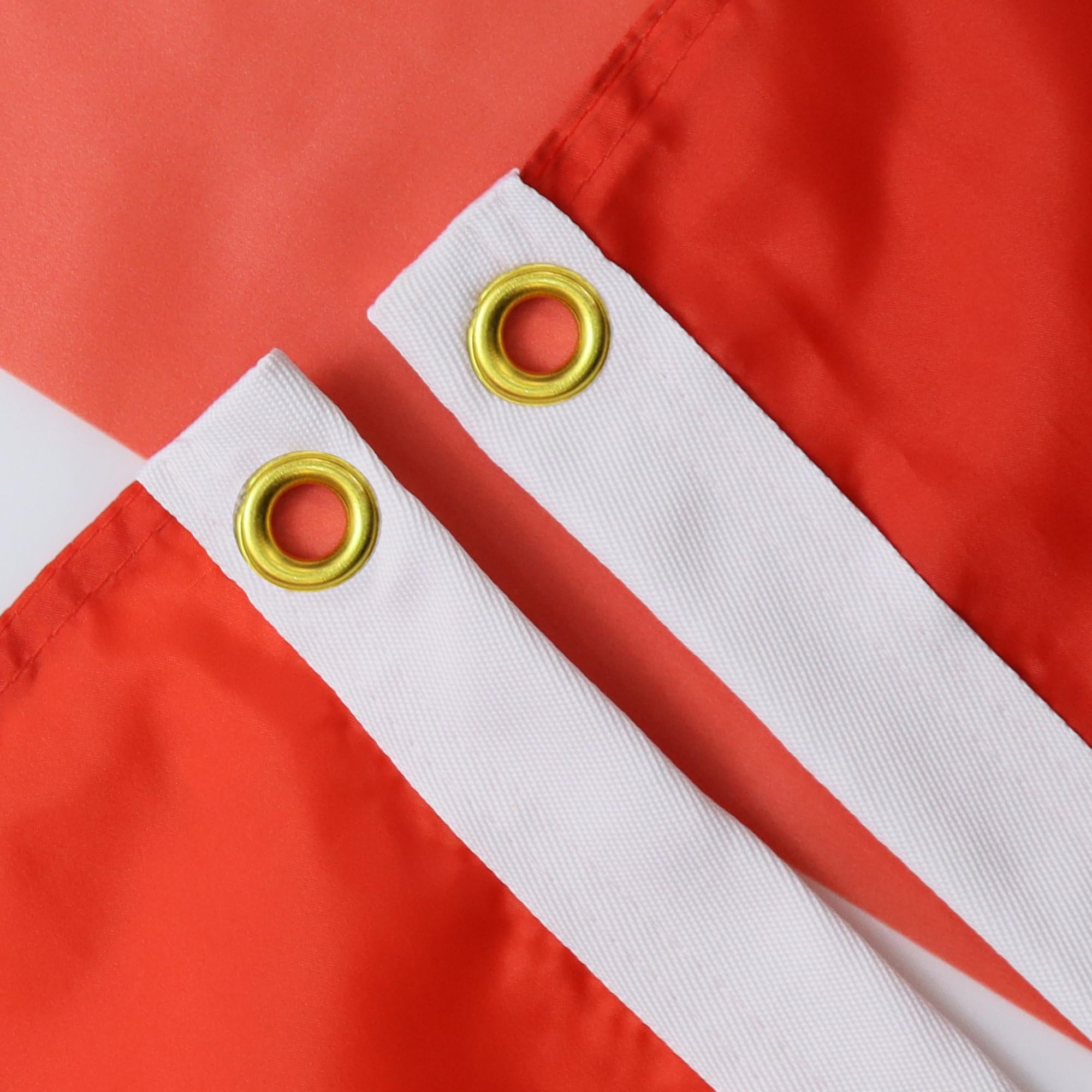 AZ FLAG detalle de textura 100D poliéster mostrando refuerzos y costuras duraderas