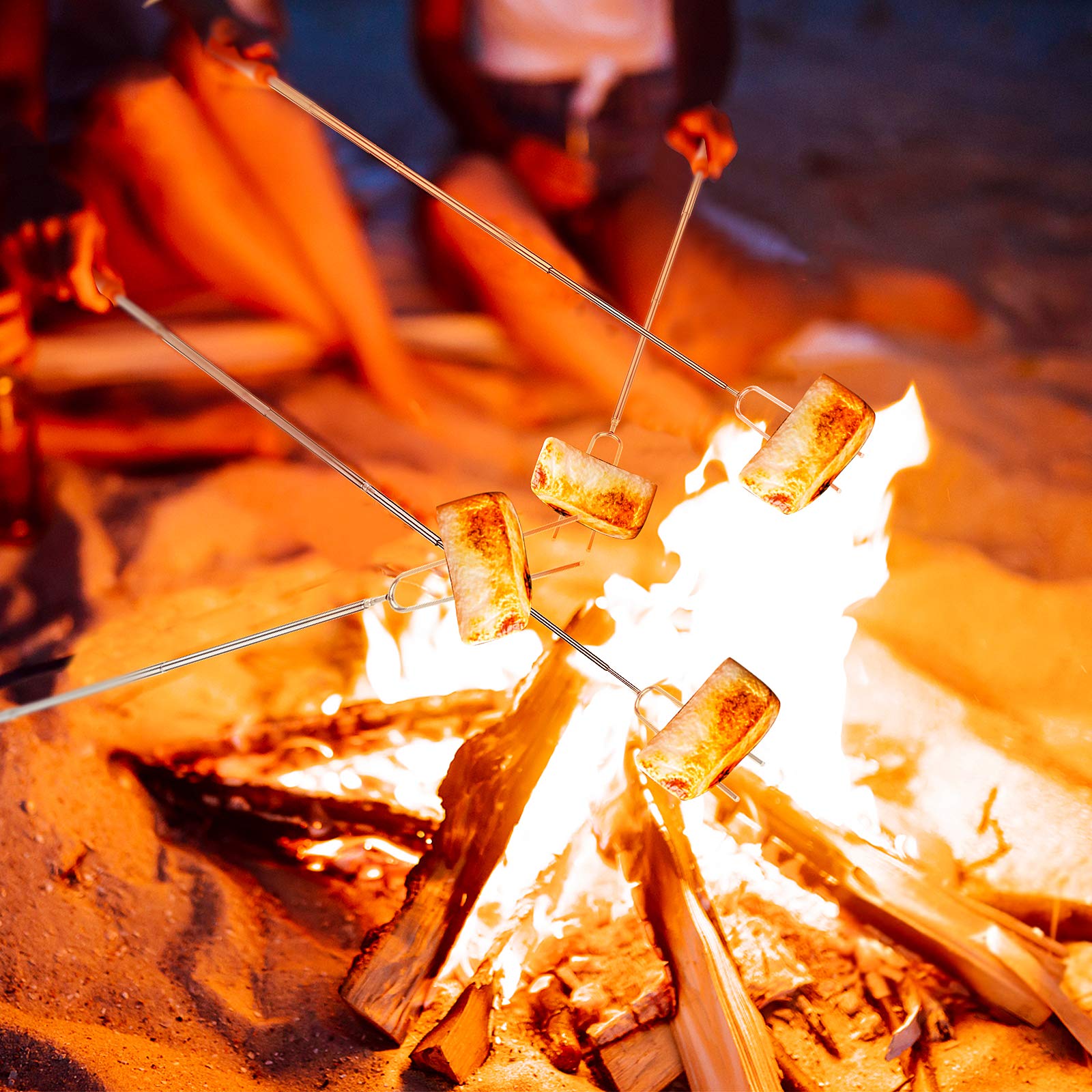 BBQStyle palos en uso sobre fogata, mantienen distancia segura