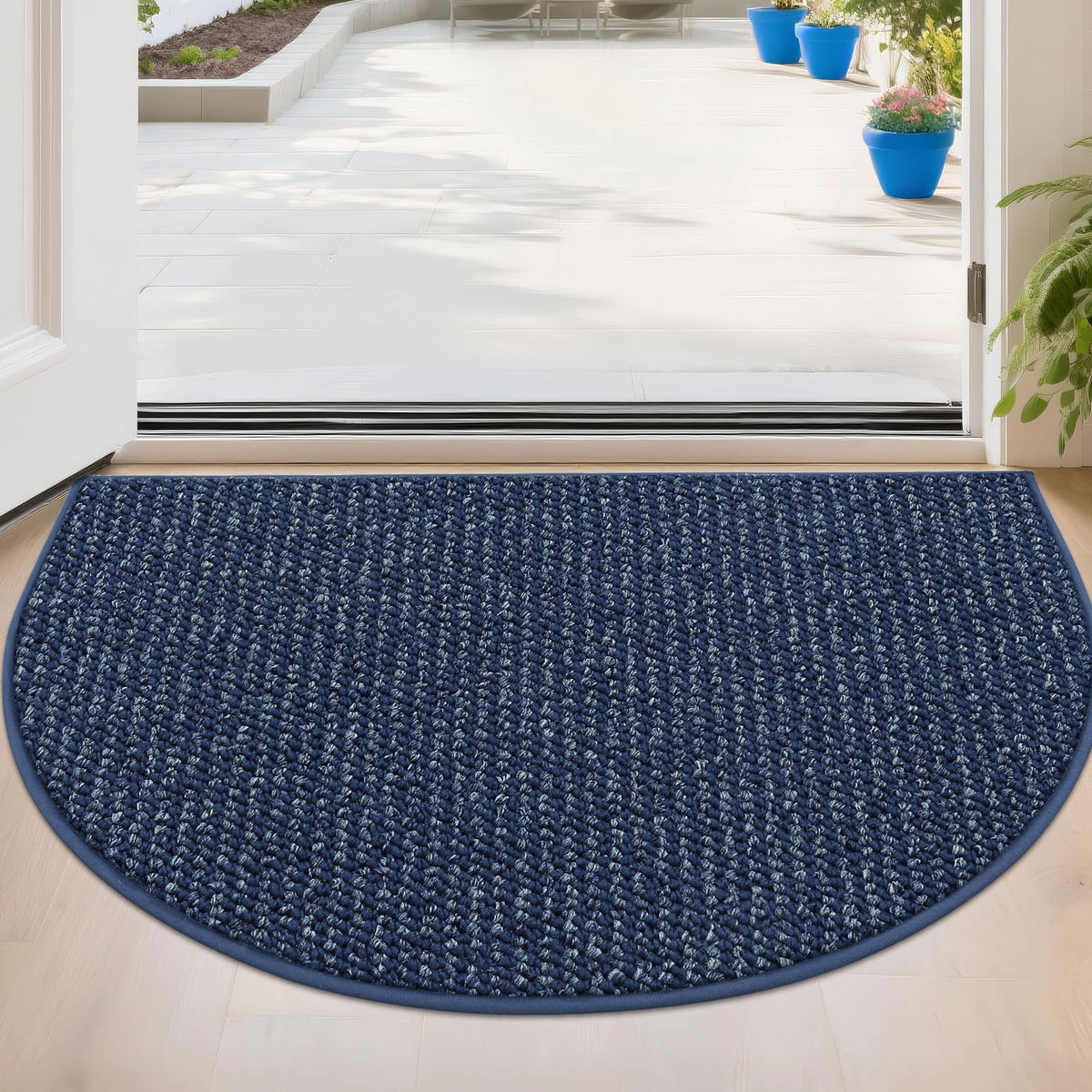BEQHAUSE felpudo semicírculo frontal mostrando diseño azul y beneficio de atrapar suciedad