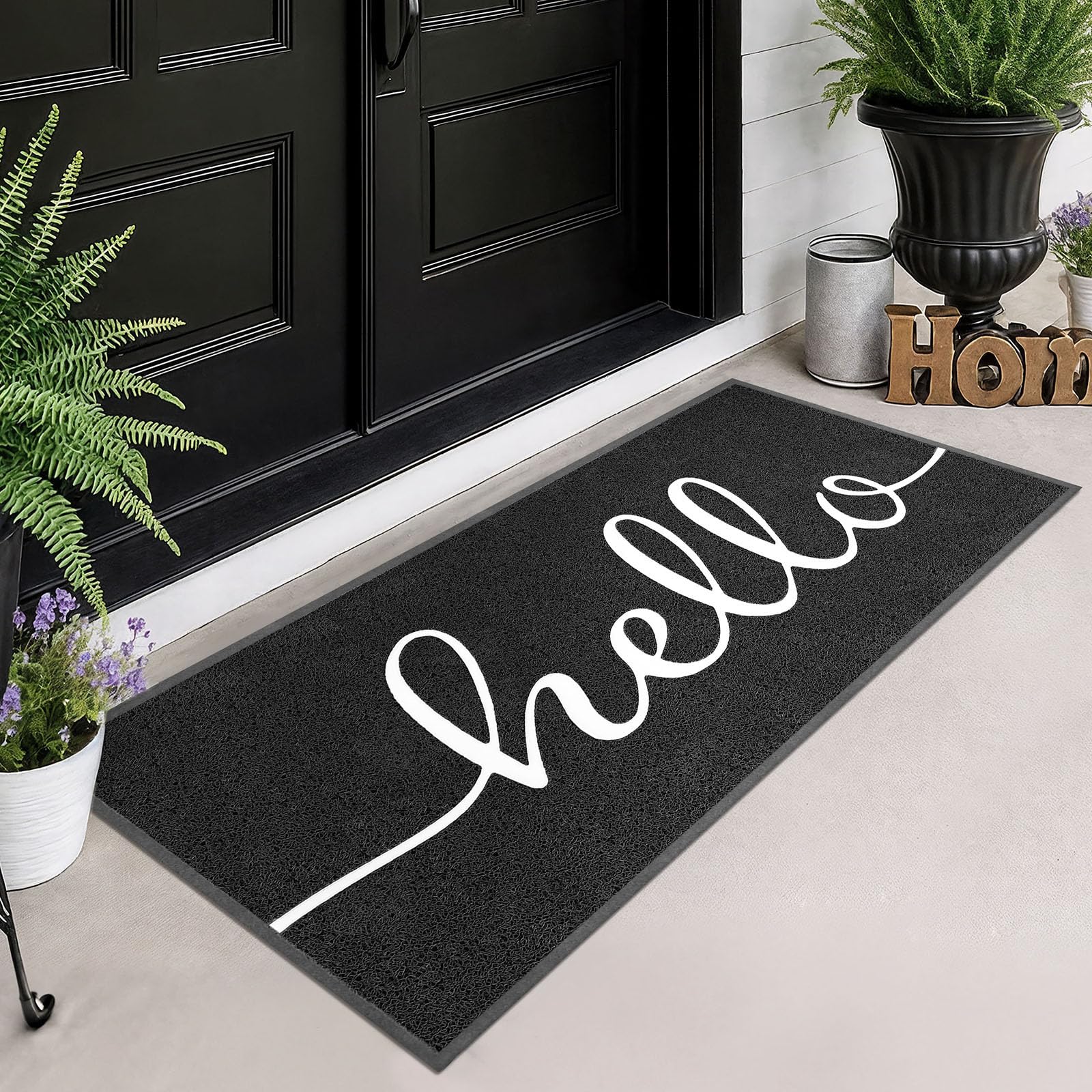 EARTHALL felpudo frontal mostrando diseño "Hello" y bienvenida duradera