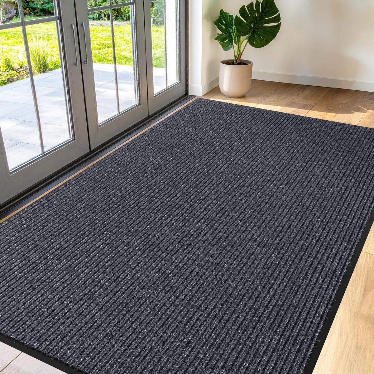 FloorGuard vista frontal del felpudo gris mostrando durabilidad y profesionalismo