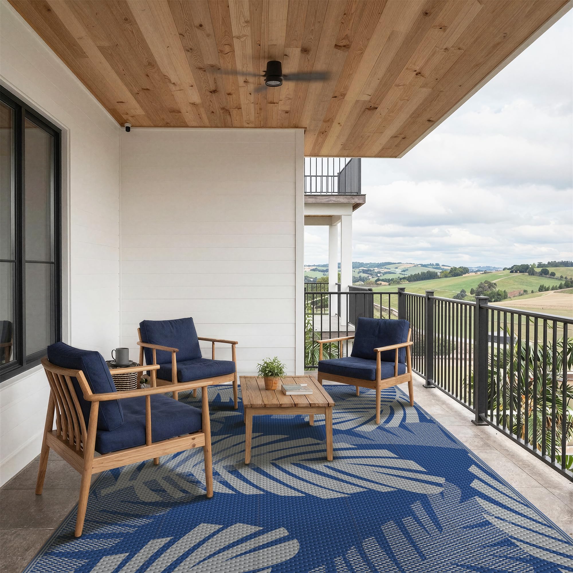 GENIMO alfombra junto a una silla para comparar tamaño 5'x8' y proporción real