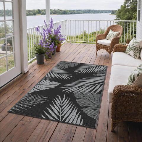 GENIMO alfombra en playa con personas mostrando portabilidad y uso familiar