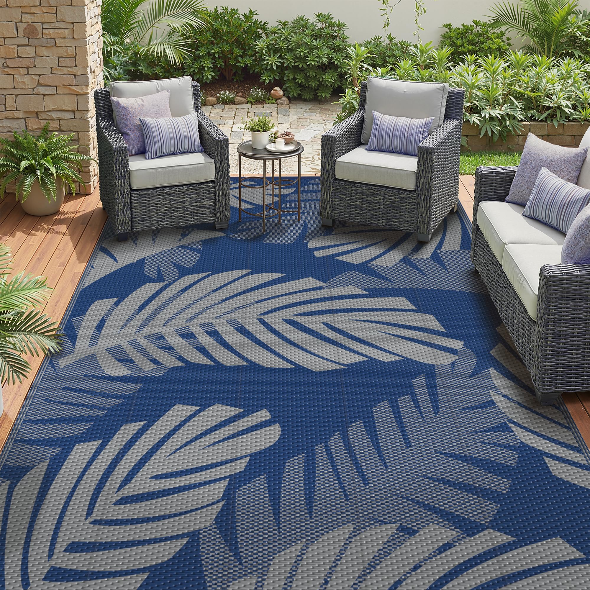 GENIMO alfombra exterior vista frontal con diseño hojas de palma y beneficio estético