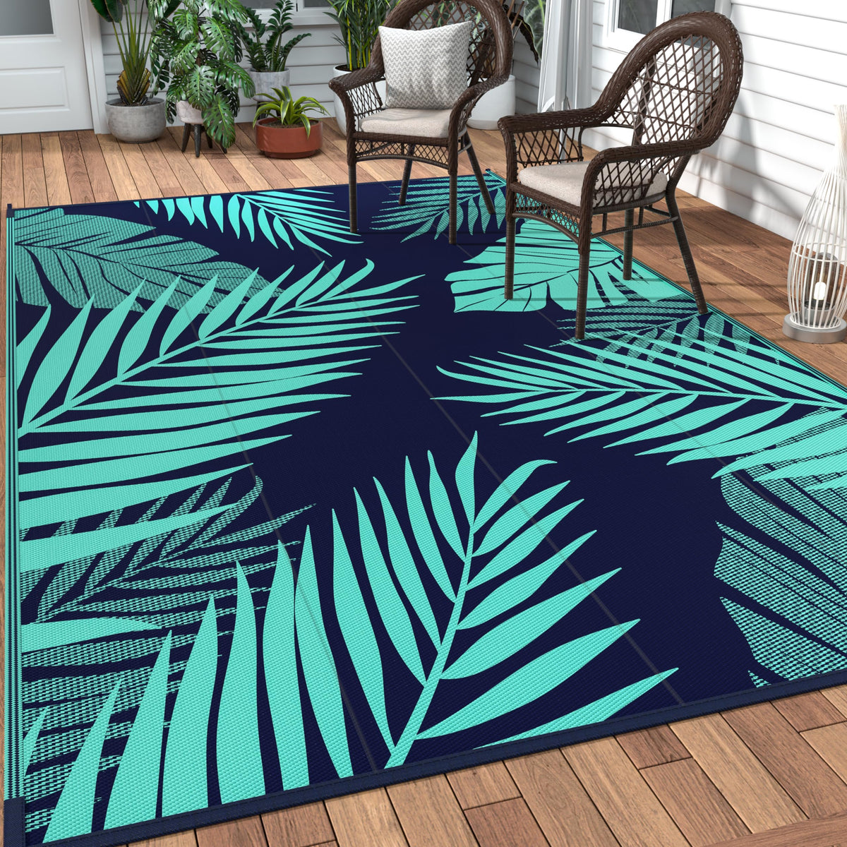 GENIMO alfombra exterior frontal mostrando patrón hojas de palma y color azul verde