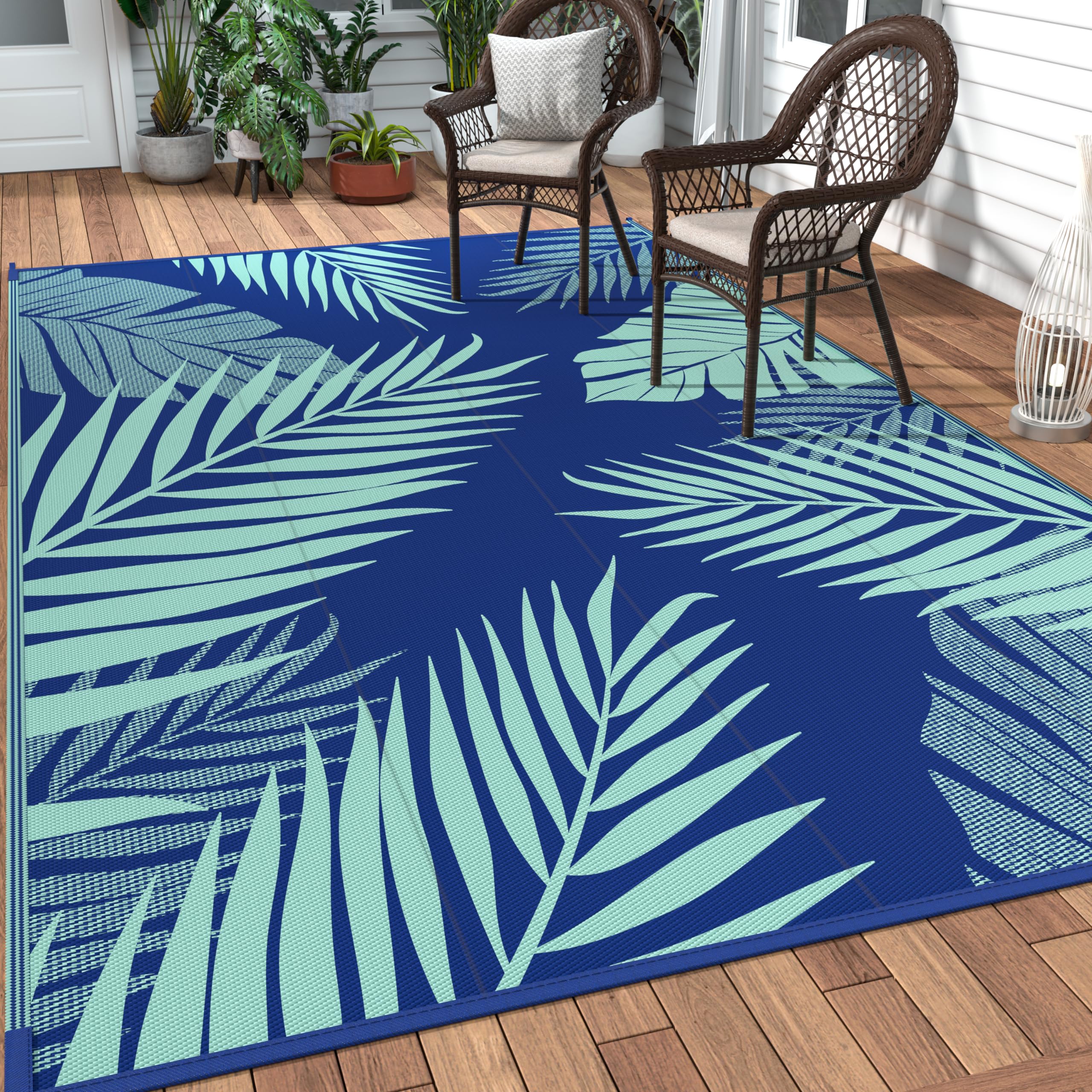 GENIMO alfombra exterior frontal mostrando patrón palm leaf y protección UV
