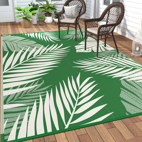 GENIMO alfombra exterior frontal mostrando el patrón de hoja y estilo tropical