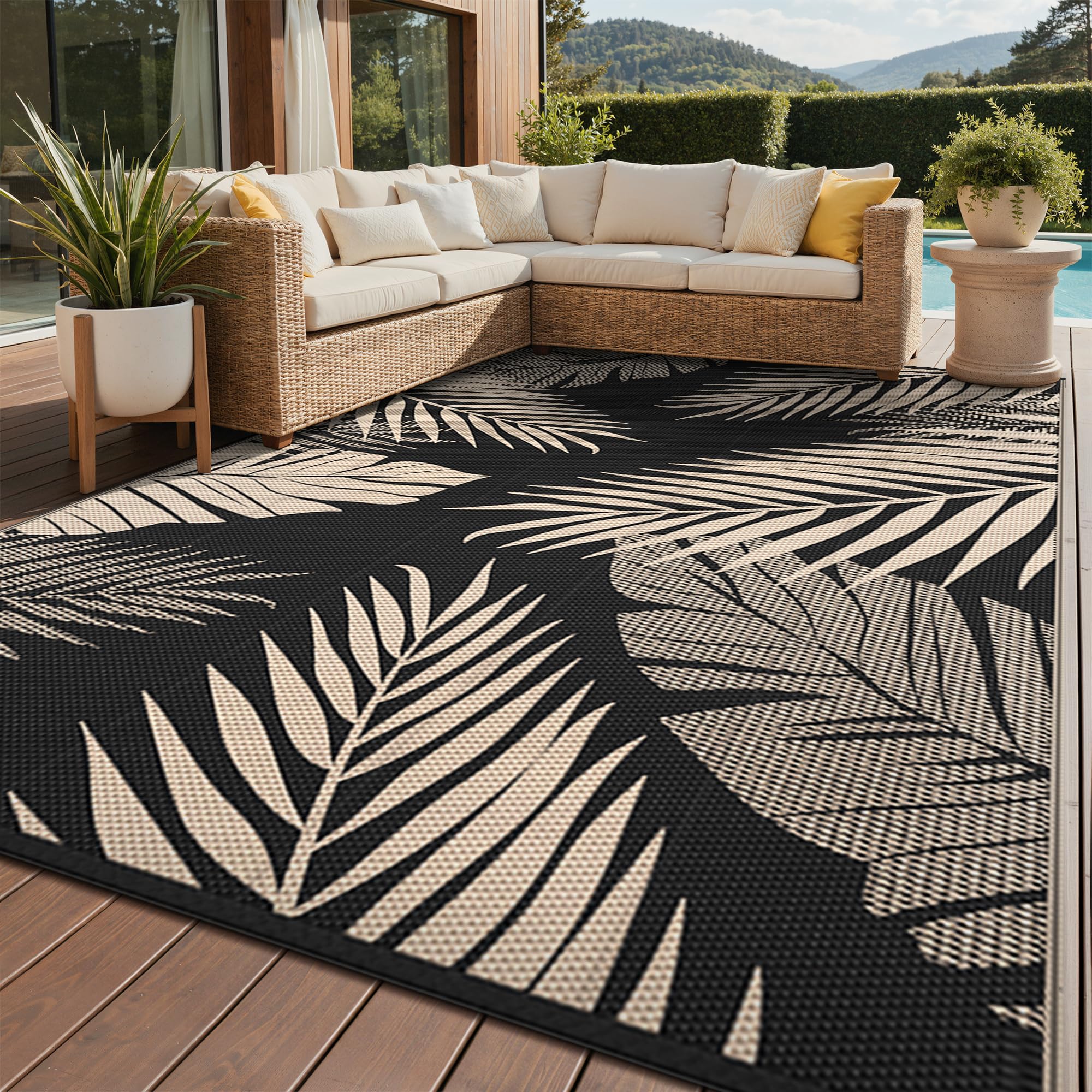 GENIMO alfombra exterior frontal mostrando diseño hojas de palma y colores elegantes