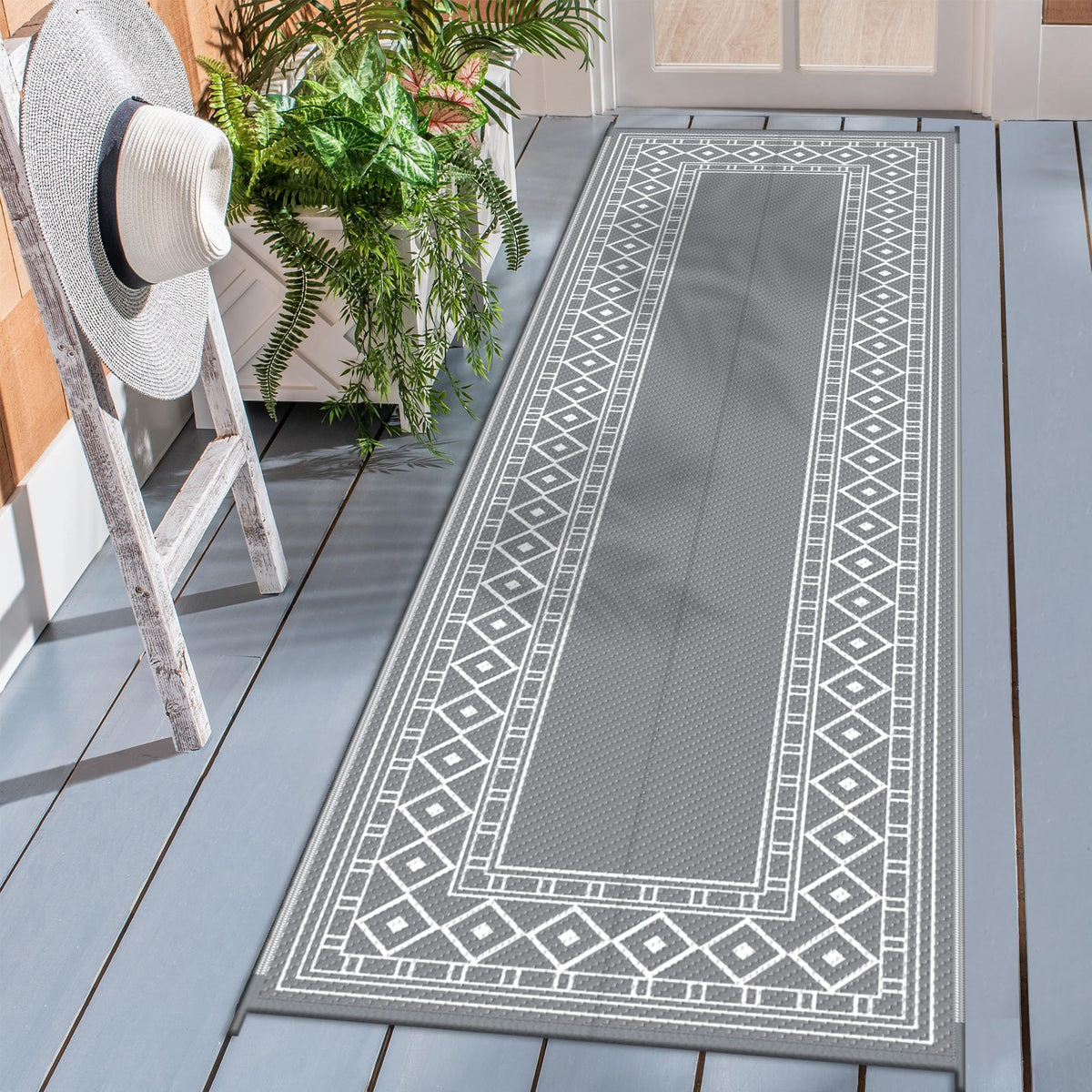 GENIMO alfombra exterior frontal mostrando diseño geométrico y beneficio estético