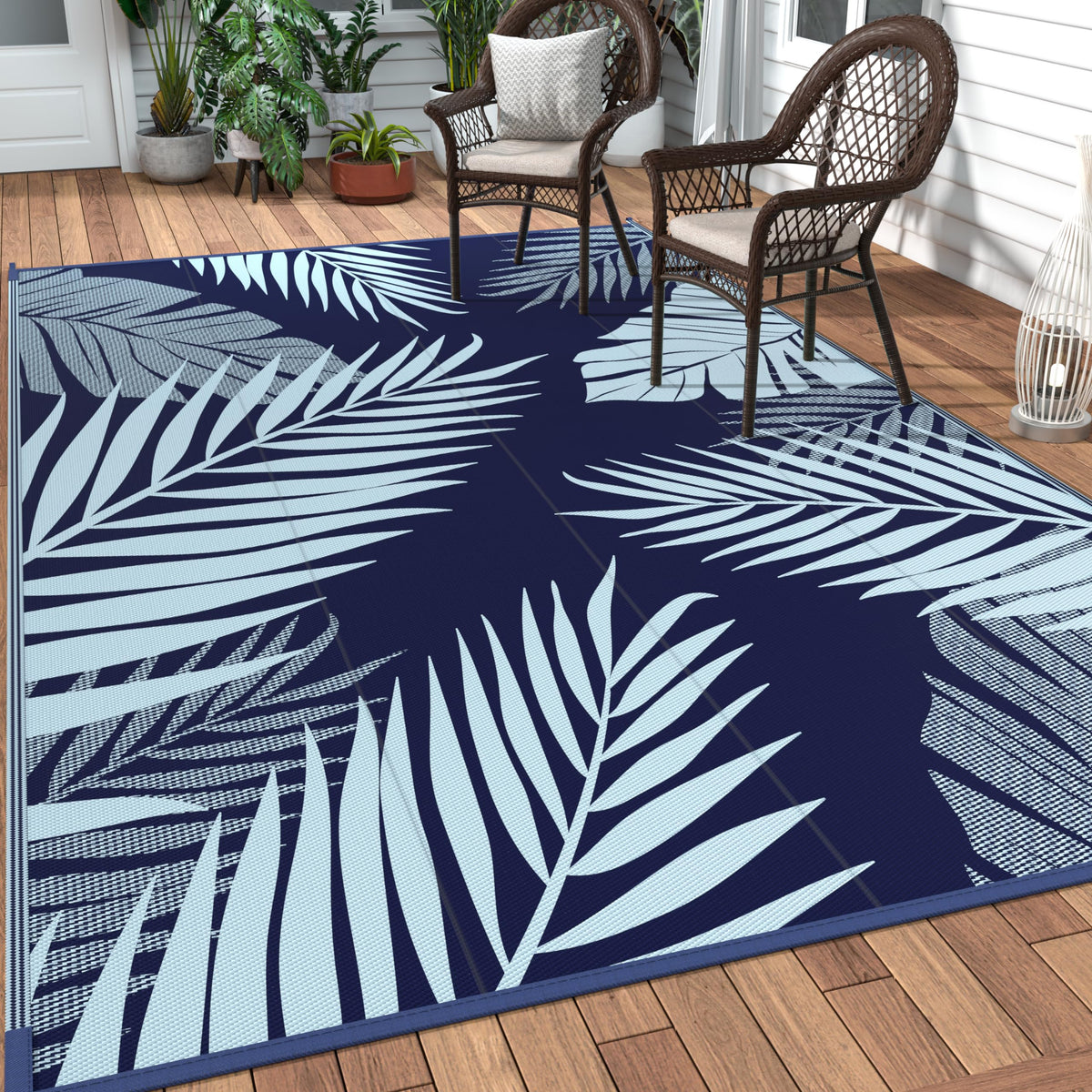 GENIMO alfombra exterior frontal azul mostrando patrón de hojas y tamaño 5x8