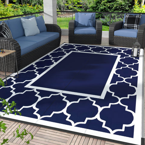 GENIMO alfombra exterior frontal mostrando diseño azul y blanco y durabilidad