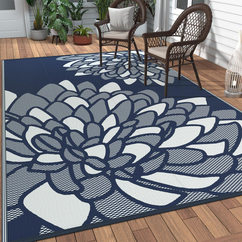 GENIMO alfombra frontal 6'x9' índigo blanco mostrando patrón palm leaf y beneficio estético