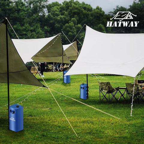 Hatway set de cuatro bolsas en playa asegurando un gazebo