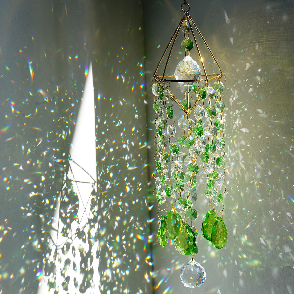 HDCRYSTALGIFTS frontal del suncatcher en su empaque, presentación elegante