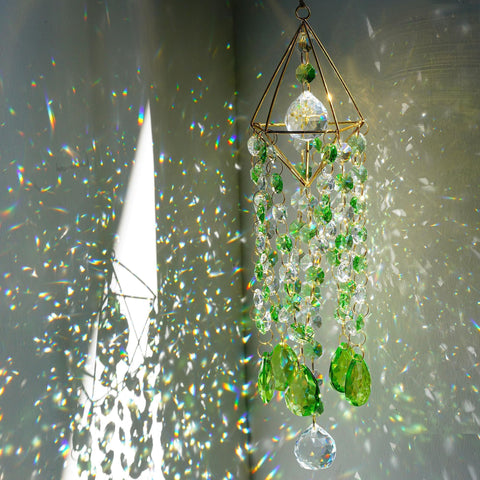 HDCRYSTALGIFTS frontal del suncatcher en su empaque, presentación elegante