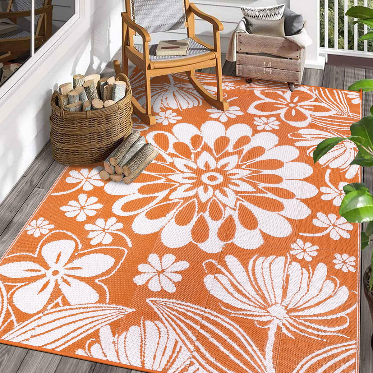 Ileading alfombra exterior frontal mostrando diseño floral naranja y estilismo