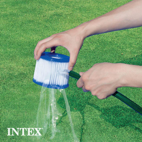 Intex cartucho al lado de regla para ver dimensiones exactas