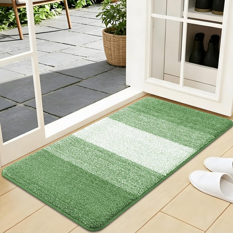 Kitinjoy felpudo vista frontal mostrando absorción y borde reforzado