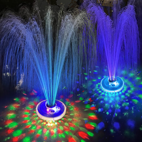 LanPool vista frontal de la fuente mostrando luces y chorros, crea ambiente nocturno