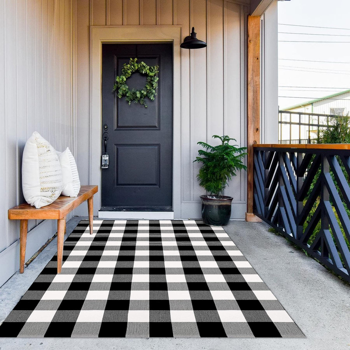 MUBIN alfombra frontal 4x6 mostrando patrón buffalo plaid y acogida