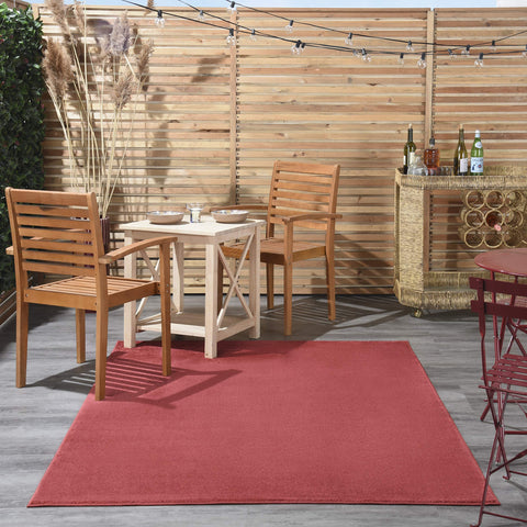 Nourison alfombra colocada en salón mostrando integración decorativa y confort