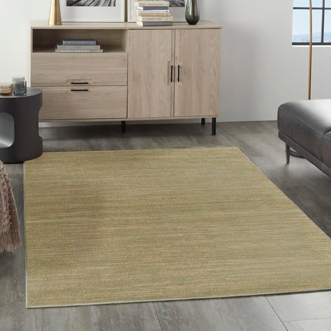 Nourison vista frontal de la alfombra mostrando diseño verde dorado y estilo contemporáneo