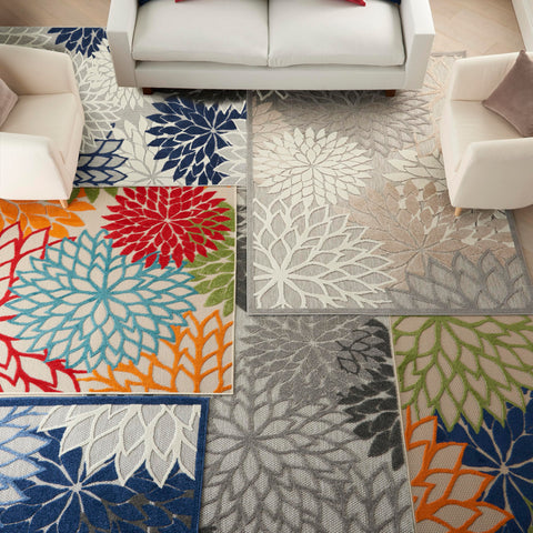 Nourison alfombra Aloha junto a cinta métrica mostrando escala 6x9